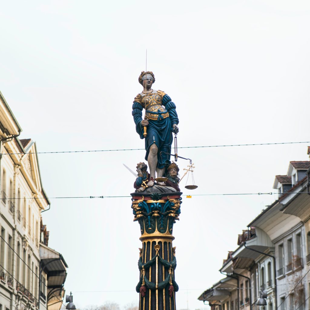 man in blue jacket statue